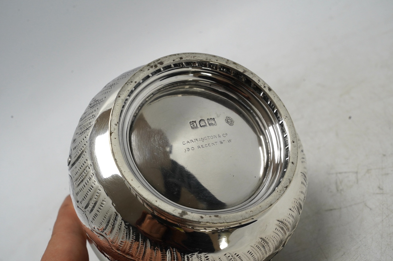 A late Victorian silver two handled sugar bowl, by Carrington & Co, London 1900, 7.3oz. Condition - poor to fair